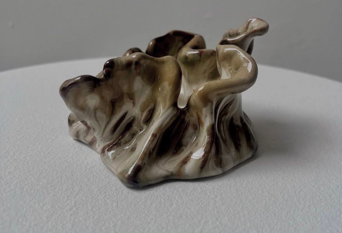 Phantom Love — folded metallic coral form.