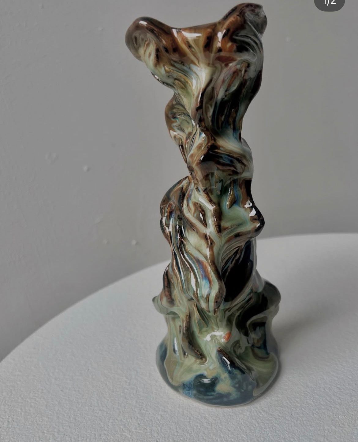 Phantom Love sculptural candleholder with marbled glaze.
